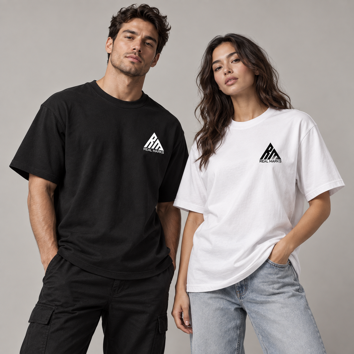 Two adults wearing black and white Real Marks heavyweight logo T-shirts