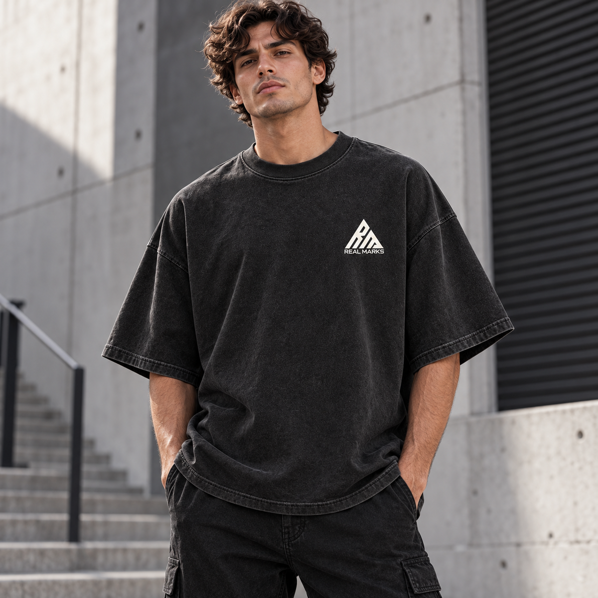 Male model wearing the washed black Real Marks Oversized Street T-Shirt