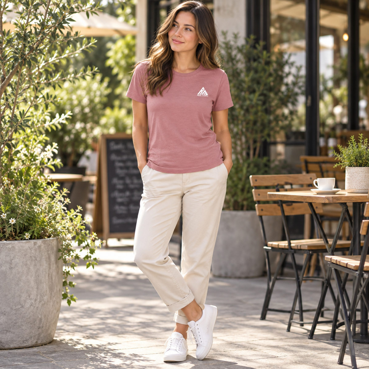 Woman wearing the dusty rose Real Marks women's essential logo T-shirt