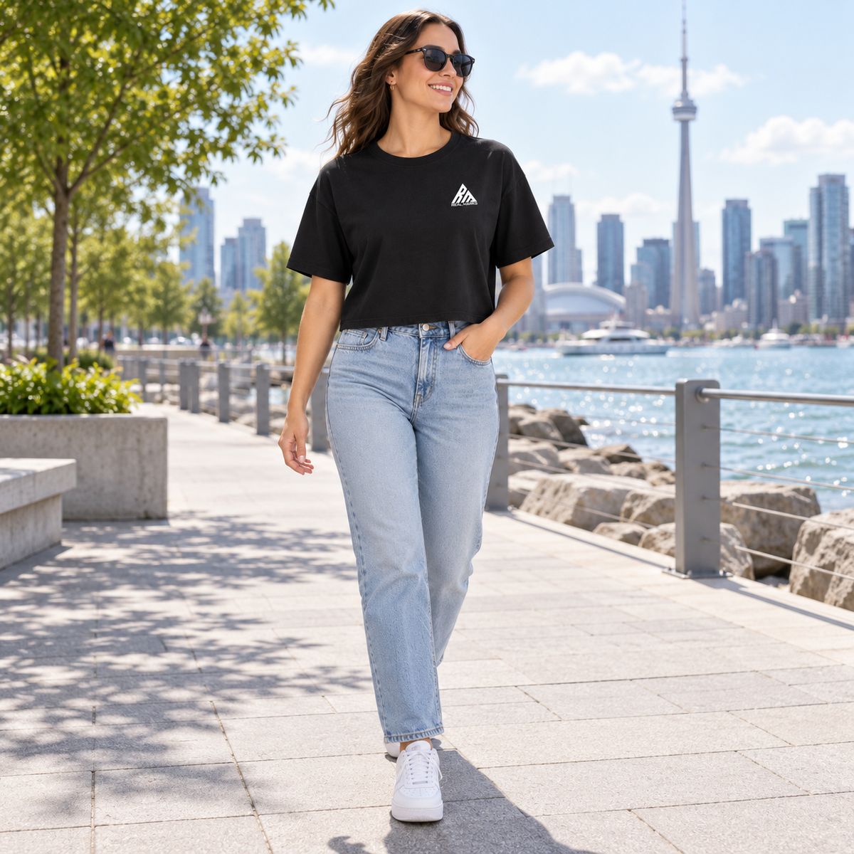 Woman wearing the black Real Marks relaxed crop T-shirt outdoors